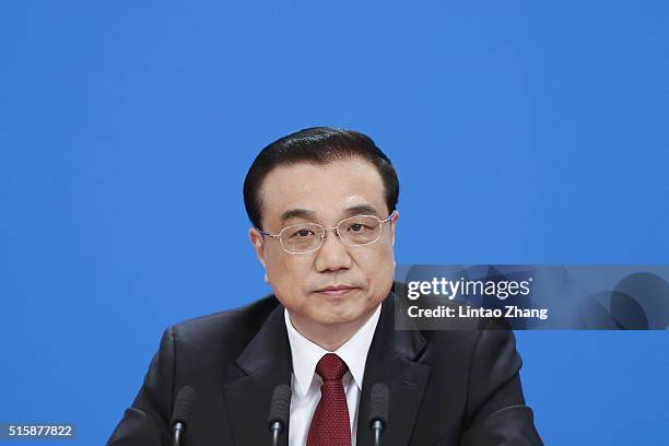 China's Premier Li Keqiang answers question during the annual news conference following the closing session of the National People's Congress at the...