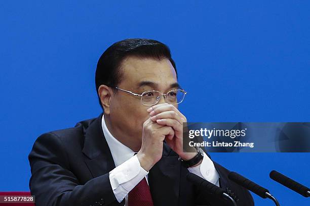 China's Premier Li Keqiang answers question during the annual news conference following the closing session of the National People's Congress at the...