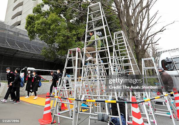 Media reporters place stepladders in front of the Tokyo Metropolitan Police headquarters in preparation for the former baseball player Kazuhiro...