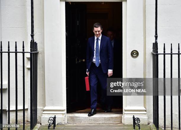 British Finance Minister George Osborne Leaves 11 Downing Street before posing for pictures with the Budget Box in London, on March 16 before...