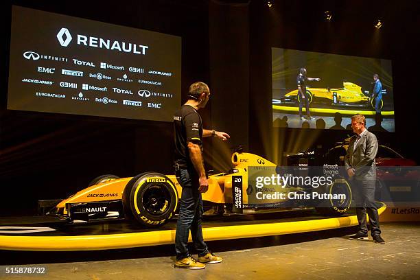 Renault F1 boss Cyril Abiteboul and David Croft discuss the new 2016 Reanault F1 team livery on March 16, 2016 in Melbourne, Australia.