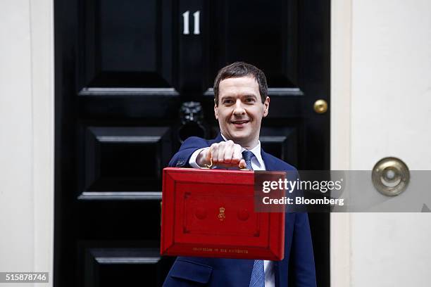 George Osborne, U.K. Chancellor of the exchequer, holds the dispatch box containing the budget, as he exits 11 Downing Street in London, U.K., on...