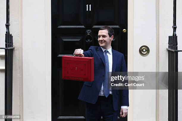 Chancellor of the Exchequer George Osborne holds his ministerial red box up to the media as he leaves 11 Downing Street on March 16, 2016 in London,...