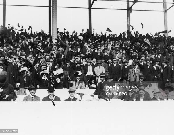 Boston Red Sox supporters in the stands at Fenway Park prior to the start of the World Series, Boston, Massachusetts, October 1912. Some spectators...