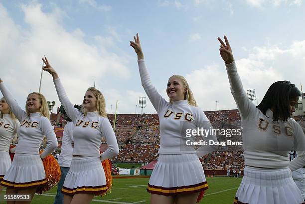 Cheerleaders for the USC Trojans perform before the game with the Arizona State Sun Devils at the Los Angeles Coliseum on October 16, 2004 in Los...