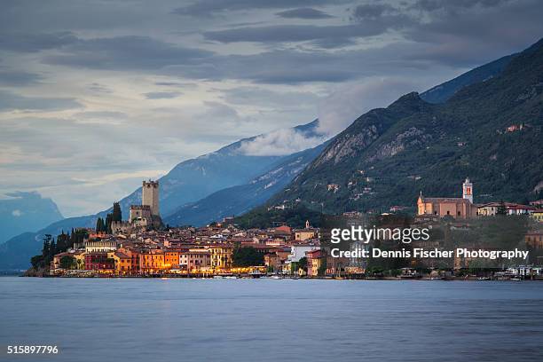 malcesine evening view - malcesine stock pictures, royalty-free photos & images