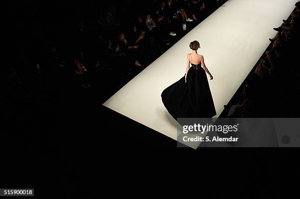 Model walks the runway at the Rasit Bagzibagli Couture show during the Mercedes-Benz Fashion Week Istanbul Autumn/Winter 2016 at Zorlu Center on...