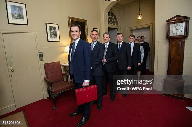 Chancellor of the Exchequer George Osborne leaves 11 Downing Street with his treasury team Lord O'Neill, Damian Hinds, David Gauke, Chris Skidmore,...