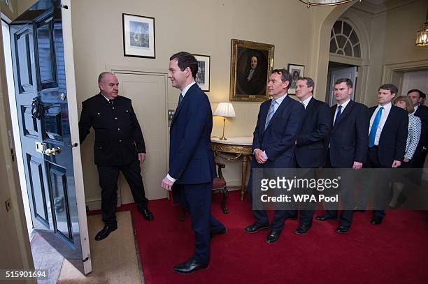 Chancellor of the Exchequer George Osborne leaves 11 Downing Street with his treasury team Lord O'Neill, Damian Hinds, David Gauke, Chris Skidmore,...
