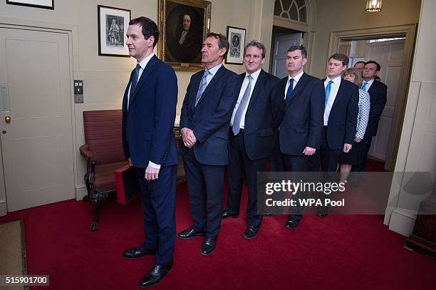 Chancellor of the Exchequer George Osborne leaves 11 Downing Street with his treasury team Lord O'Neill, Damian Hinds, David Gauke, Chris Skidmore,...