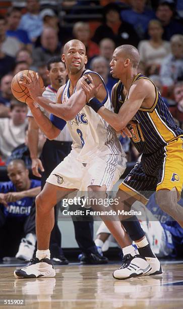 Forward Monty Williams of the Orlando Magic posts up guard Reggie Miller of the Indiana Pacers during the NBA game at TD Waterhouse Centre in...