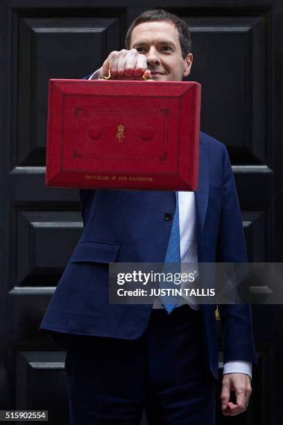 British Finance Minister George Osborne poses for pictures with the Budget Box as he leaves 11 Downing Street in London, on March 16 before...