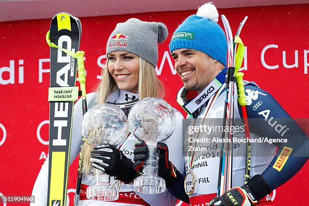 Lindsey Vonn of the USA and Peter Fill of Italy win the downhill crystal globes during the Audi FIS Alpine Ski World Cup Finals Men's and Women's...