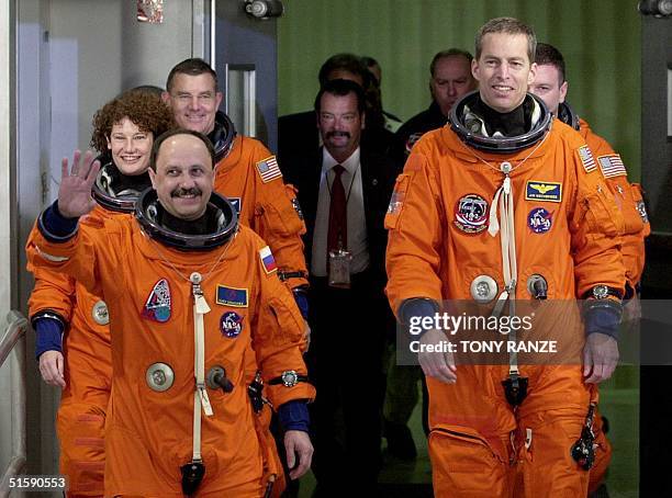 The crew of the space shuttle Discovery Mission Specialist Yury Usachev, Commander James Wetherbee; , Mission Specialist Susan Helms, Pilot James...