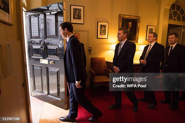 Chancellor of the Exchequer George Osborne leaves 11 Downing Street with his treasury team Lord O'Neill, Damian Hinds, David Gauke, Chris Skidmore,...