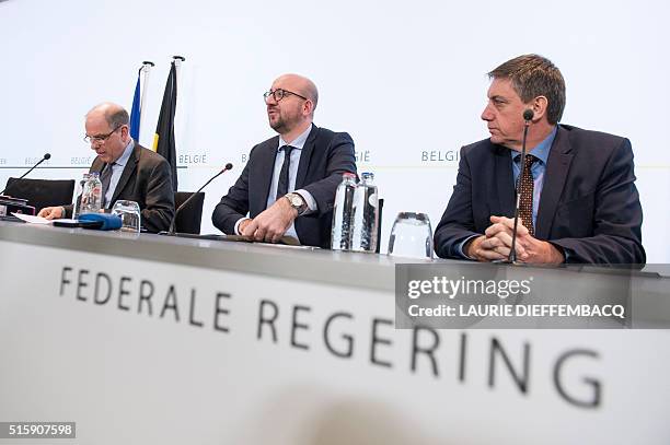 Belgian Justice minister Koen Geens, Belgian Prime Minister Charles Michel and Vice-Prime Minister and Interior minister Jan Jambon attend a press...