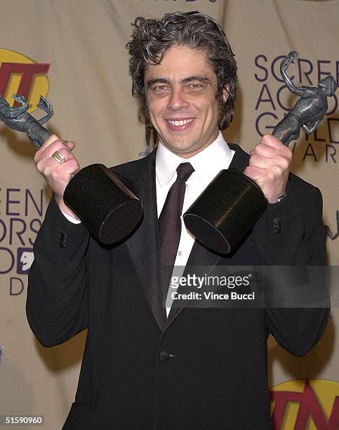 Actor Benicio Del Toro poses backstage with his awards for Outstanding Performance by a Male Actor in a Leading Role in a Motion Picture and...