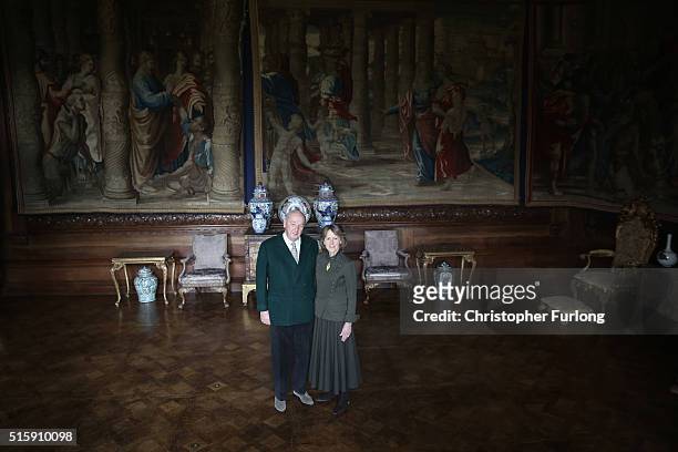 The Duke and Duchess of Devonshire pose next to the renovated Mortlake Tapestries at Chatsworth House on March 16, 2016 in Chatsworth, England....