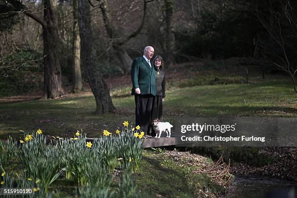 The Duke and Duchess of Devonshire pose with their dog Max for a portrait in Chatsworth's ornamental Trout stream and Paxtons rockery garden whiuch...