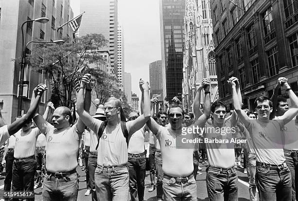 Men join hands at the Gay Pride Parade in New York City, USA, June 26, 1983.