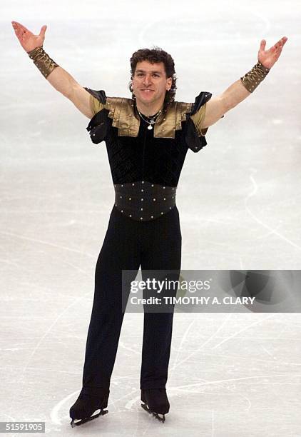 Former World Champion Elvis Stojko of Canada acknowledges the crowd after his Free Skate program 22 March at the World Figure Skating Championships...