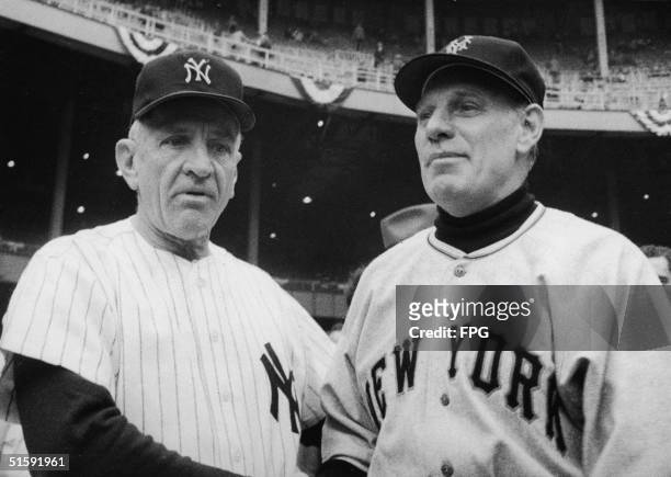 The managers of the two opposing teams in the World Series, Casey Stengel of the New York Yankees and Leo Durocher of the New York Giants, pose...