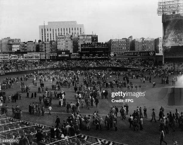 Spectators leave Yankee Stadium after the first game of the World Series, following a bottom of the ninth inning home run from Tommy Henrich which...