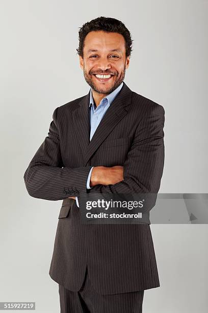 confident business executive with his arms crossed - business man isolated bildbanksfoton och bilder