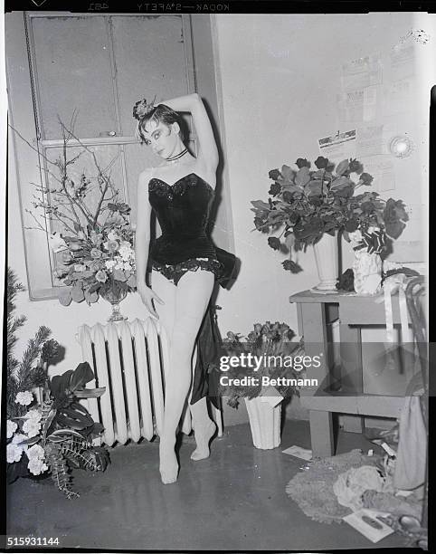 New York, NY: Husband asks divorce. Leslie Caron, French dancer who's made a hit in American movies, relaxes in her dressing room before the opening...