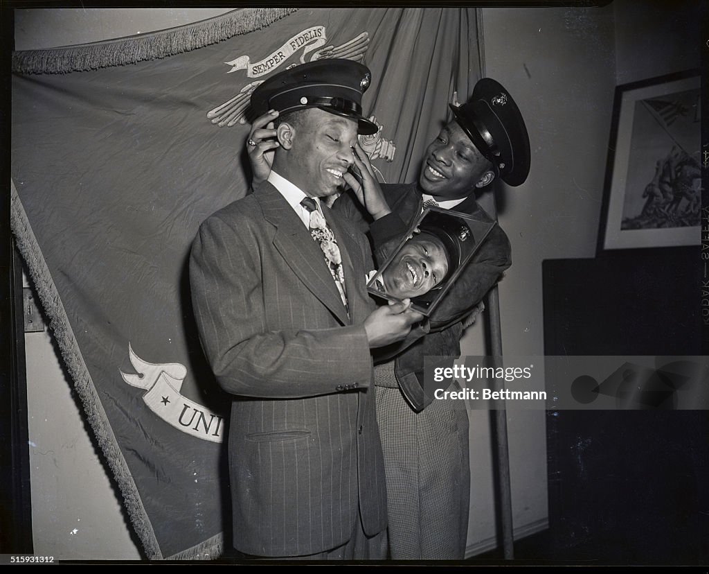Sandy Saddler Trying On Marine Corps Cap