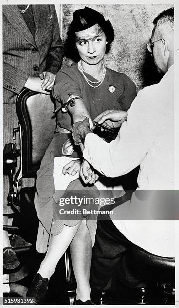 Montclair, NJ: Mrs. Wright MacMillan, Chairman of the Hygiene Committee of the league of women voters, is here shown taking a Wasserman test for...