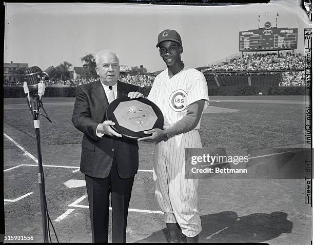 Chicago, IL: Warren Giles , President of the National League, presents Chicago Cubs shortstop Ernie Banks with the Most Valuable National League...