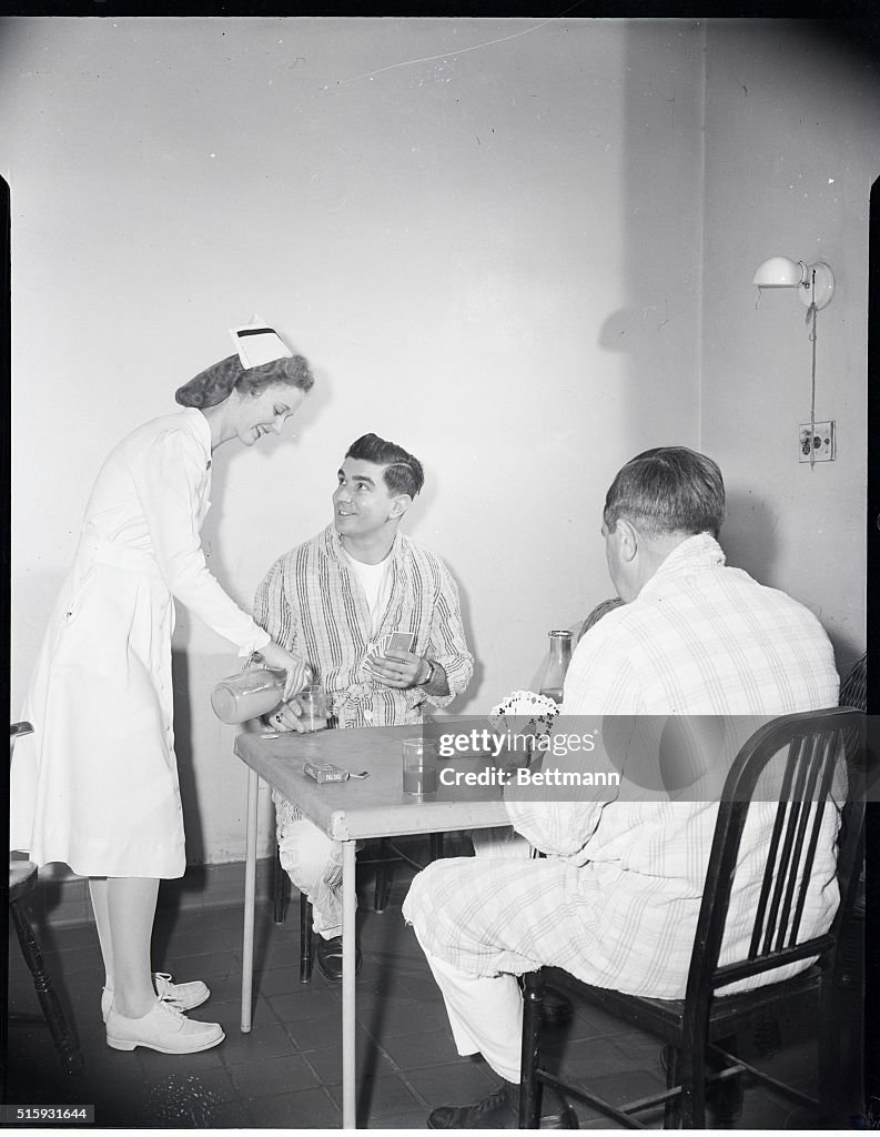 Nurse Attending Card-Playing Patients