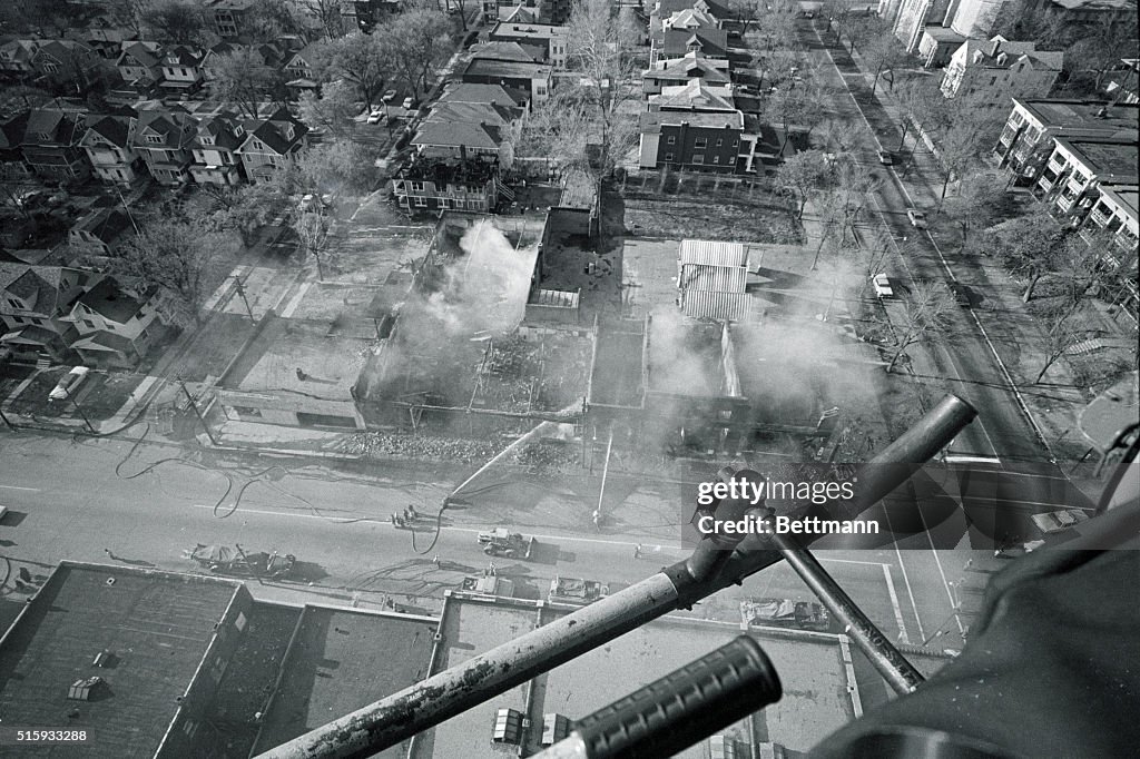 59 Riot Aftermath Aerial view shows smoldering block of buildings on the city's... News ...