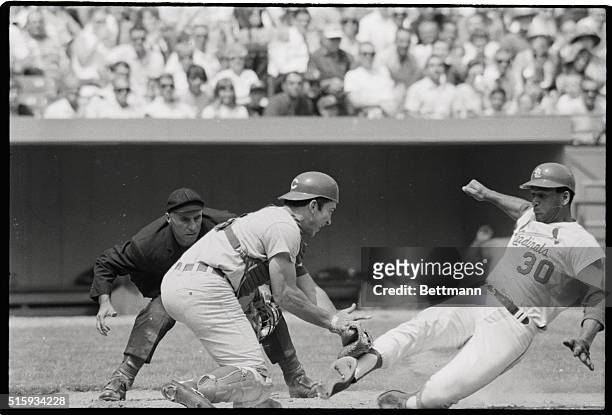 St. Louis, MO: Cardinals' Orlando Cepeda is tagged out by Cincinnati Reds' catcher Johnny Bench as he tries to score in the sixth inning of the...