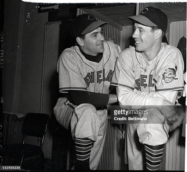 Boston, MA: Manager Lou Boudreau poses with starting pitcher Bob Feller of the Indians before the start of the first game of the 1948 World Series...