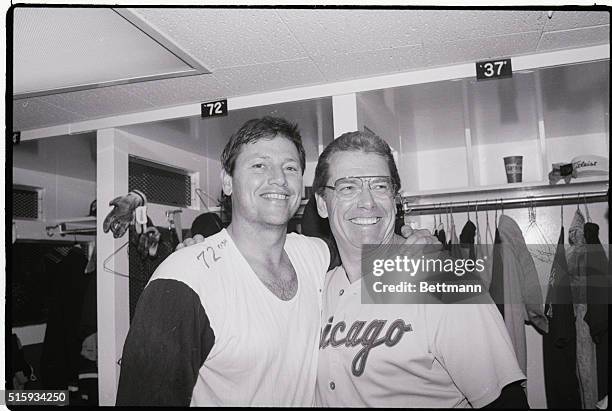 New York, NY: Chicago White Sox's manager Jeff Torborg was all smiles and he congratulated his catcher Carlton Fisk in the locker room after the game...