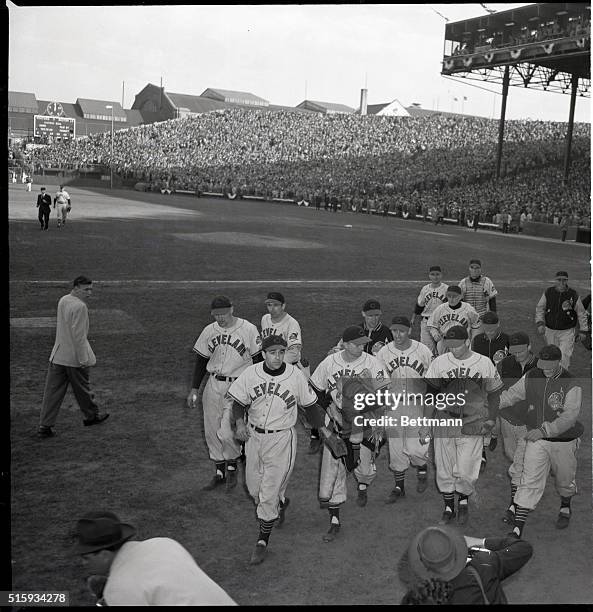 Boston, MA: Bob Lemon is escorted off the field by teammates after he pitched the Cleveland Indians to a 4-1 victory over the Braves in the second...