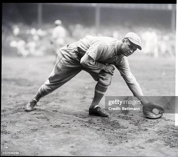 Jimmy Foxx of Philadelphia Athletics fielding a ground ball.