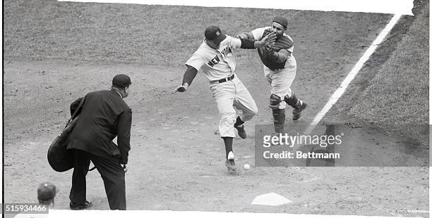 New York, NY: Bill Skowron of the Yankees knocks the ball from the hand of Dodger catcher Roy Campanella to score the second run in the second inning...
