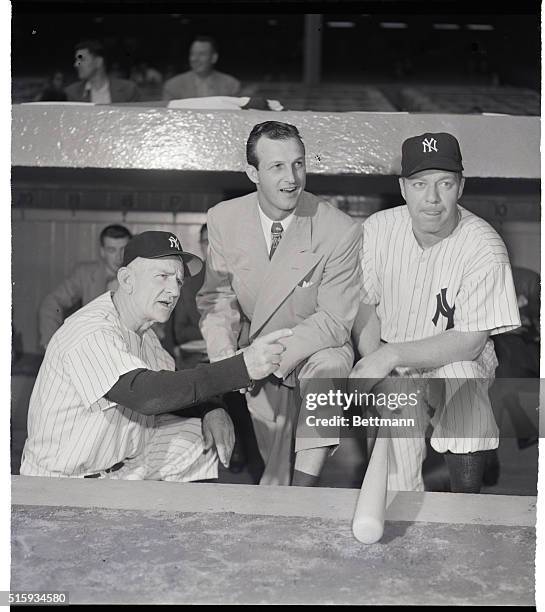 New York, NY- Yankee manager, Casey Stengel points out some strategic locations to World Series spectator Stan Musial of the St. Louis Cards. Ed...