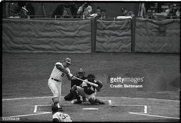 St. Louis, MO: Cards' Roger Maris takes a vicious swing to drive the ball into left field for a two-run double in the first inning of the fourth game...