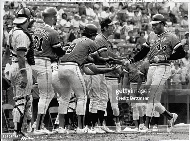 Atlanta, GA- Giants' Willie McCovey is greeted at home plate by teammates after blasting his 500th career homerun in action with the Atlanta Braves...