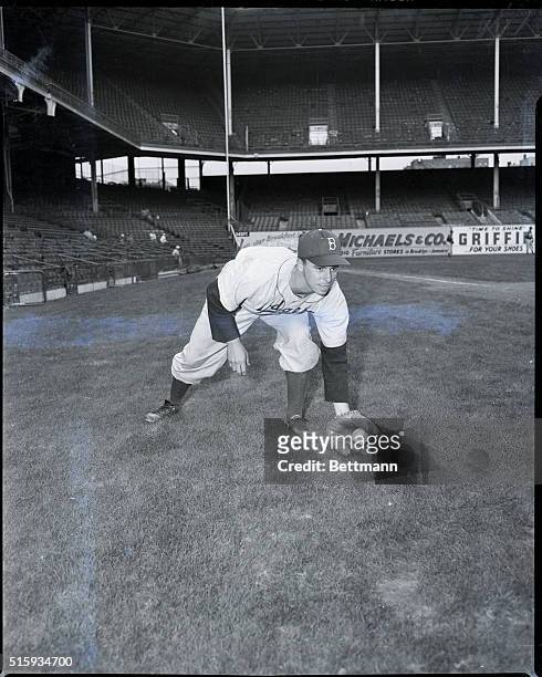Brooklyn, NY: Brooklyn Dodgers' Pee Wee Reese posing in fielding stance.