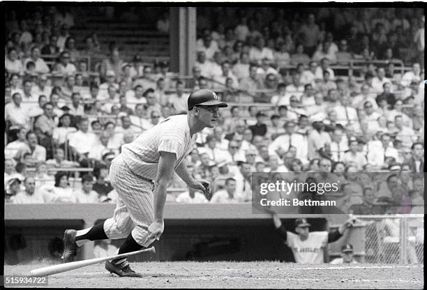 New York: Roger Maris, of the New Yankees, drops his bat after rapping a pinch-hit single in the seventh inning of game against the Los Angeles...