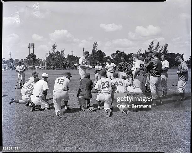 Vero Beach, FL: Photo shows Dodger pitching coach Joe Becker talking to the big men of the Dodger staff. Left to Right are: Don Bessent, Sandy...