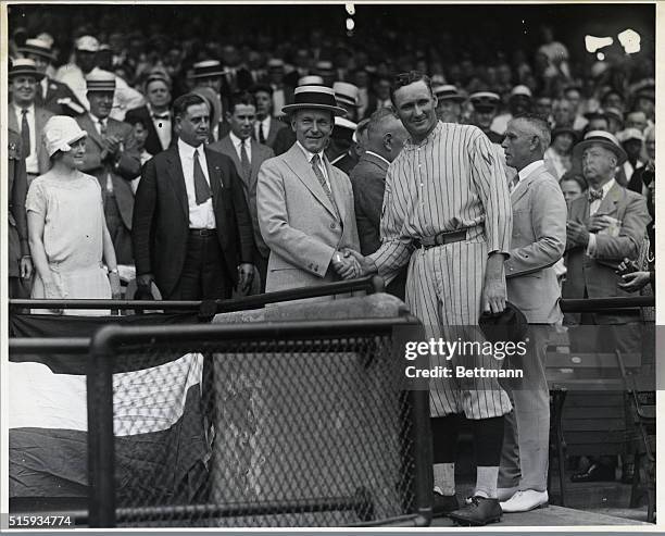 Washington, D.C.: President Coolidge presenting Walter Johnson with a 1924 American League diploma.