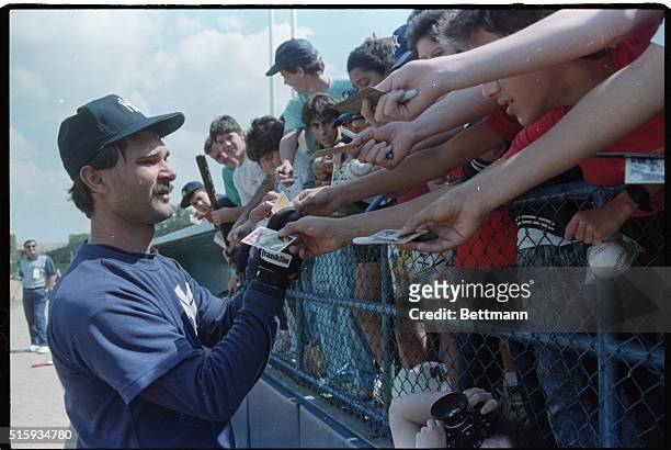 Fort Lauderdale, FL: Don Mattingly, the most popular Yankee, obliges fans at spring training. Mattingly has predicted a champioship for the Yankees...