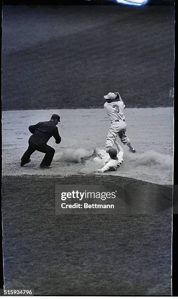 New York,NY- Carl Hubbell, NY Giants pitching ace, slides safely into second base in the six inning of the game with the Boston Bees at the Polo...