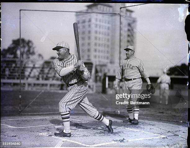 Sarasota, FL: Second baseman Rogers Hornsby batting and Roger Bresnahan catching at the New York Giants' spring training camp.